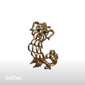 Vintage Avon Gold Tone Dog Brooch with Green Rhinestone Eyes